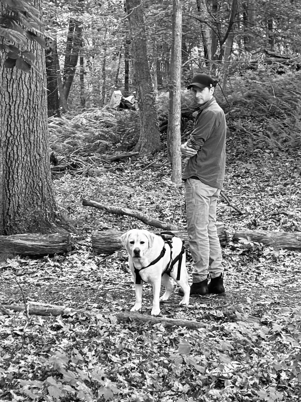 William Bruno and his dog on a walk in the woods